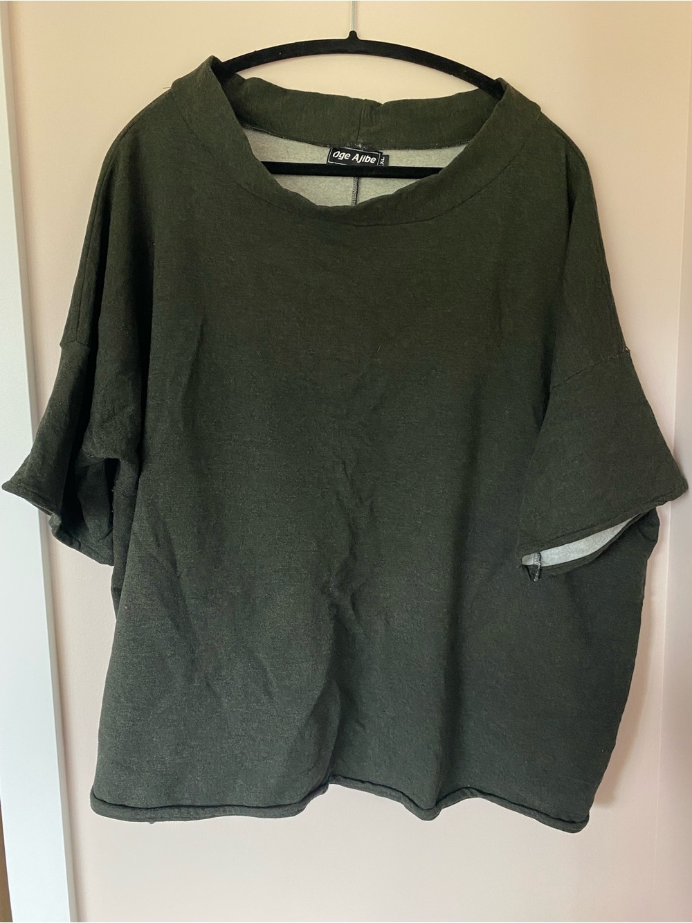 Oge Agibe mock neck fleece top